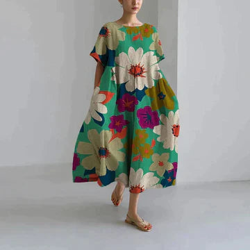 Robe longue verte avec imprimé de fleurs colorées pour un look bohème